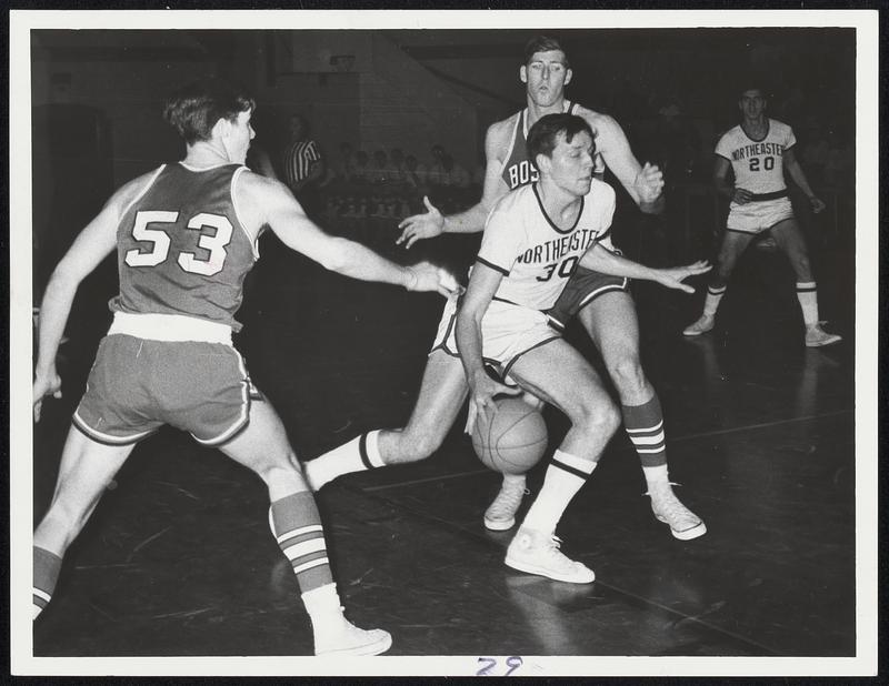 On The Move - Northeastern's Mike Wallent (30) drives between B.U. players Bill Berg (53) and Randy Robinson en route to basket in Colonial basketball opener at Tufts