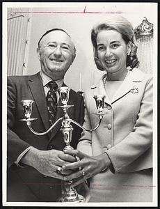 Mother of the Year of Temple Bnai Moshe, Mrs. Kevin H. White, received candleabra from Temple President Jack Kardon.