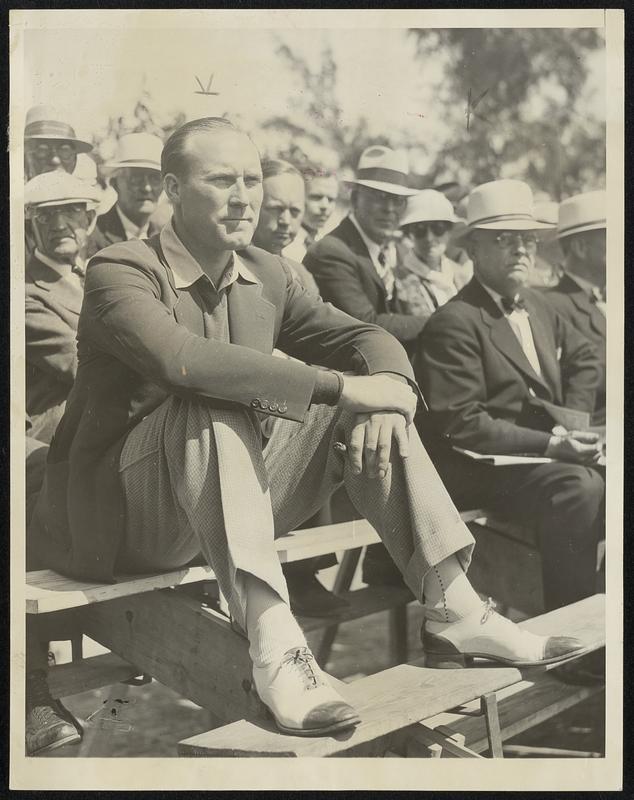 Hold-out Ruffing Parks In Bleachers. St. Petersburg, Fla., March 20 -- Still Holding out is Charlie Ruffing, New York Yankees pitcher, here shown in the Bleachers while his team mates engaged in a little pre-season fray with the Cincinnati Reds.