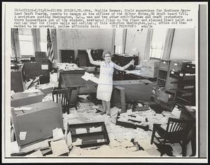 Mrs. Phyllis Renner, field supervisor for Southern Maryland Draft Boards, reacts to damage at the offices of the Silver Spring, Md draft board 5/21. A scripture quoting Washington, D.C., man and two other anti-Vietnam and draft protesters threw typewriters out of the windows, scattered files on the floor and slopped black paint and red ink over the floors walls and ceiling of this suburban Washington, D.C., office and then waited to be arrested, police officials said.