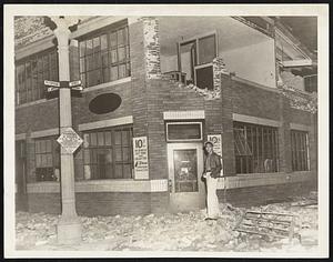 Damaged Building in Quake-Rocked Long Beach. This building in Long Beach, Calfi., occupied by a laundry, was shaken severely and badly damaged in the earthquake of March 10. The entire upper part of the wall has tumbled to the street.