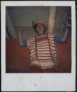 Woman wearing a cowboy hat and posing