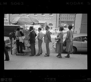 Sidewalk diners lining up at Sabrett lunch cart, Atlantic Avenue, Boston