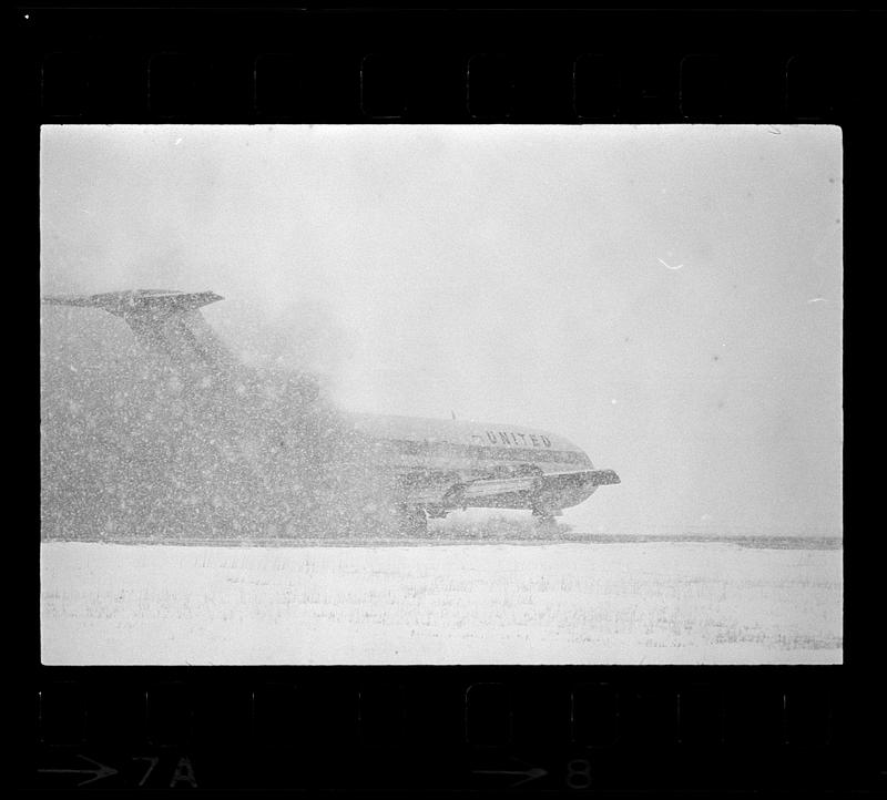 An airliner lands in a snowstorm at Logan Airport, East Boston