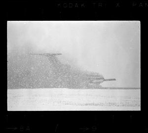 An airliner lands in a snowstorm at Logan Airport, East Boston