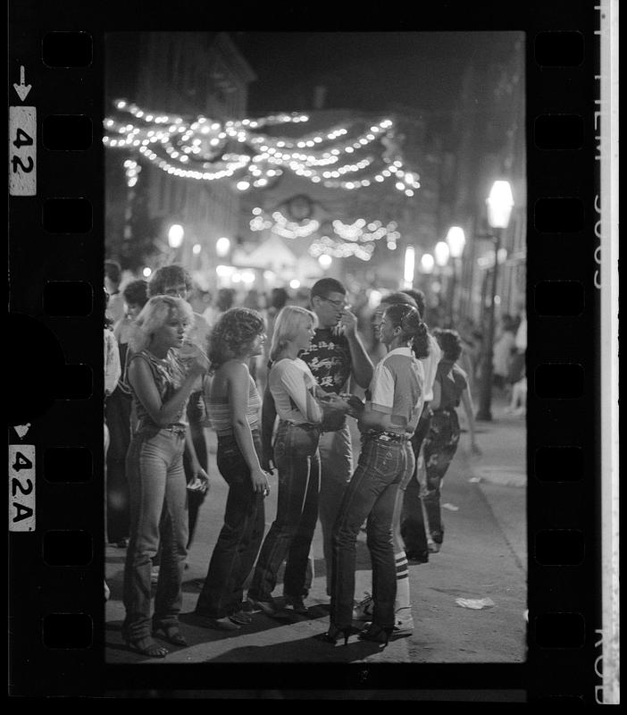 Couples on Hanover Street during St. Della Cava festival, Boston