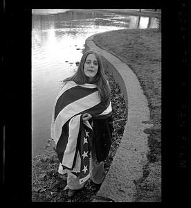 Enigmatic girl wrapped in U.S. flag, Cambridge