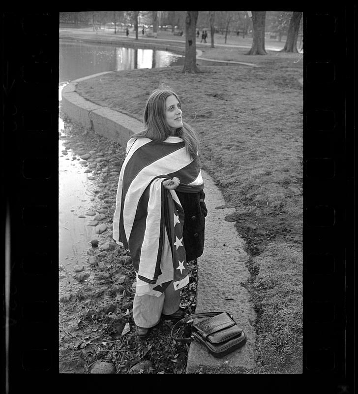 Enigmatic girl wrapped in U.S. flag, Cambridge