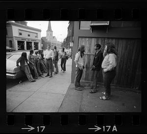 Teens hang out on Centre Street in Jamaica Plain in summertime, Boston