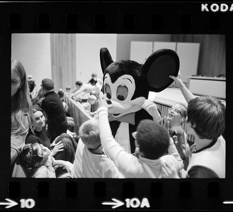 Blind children meet Mickey Mouse by touch at Perkins School for the Blind, Watertown