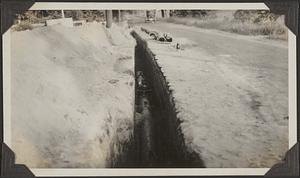 Pipe in a trench showing a gate valve