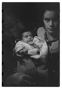 Mercedes Pasarell Sanromá holding a baby