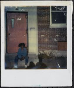 Girl sitting on the stoop