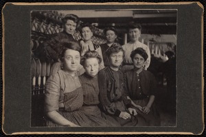 Group portrait of eight textile mill workers