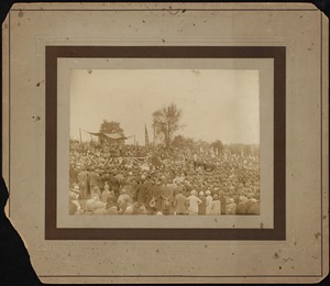 Crowd gathered in a cemetery