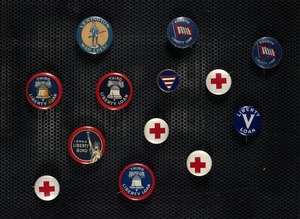 Collection of Liberty Loan buttons, pins and coins