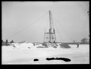 Wachusett Department, Wachusett-Sudbury power transmission line, Sudbury Reservoir crossing, erecting 68-foot steel tower at southwesterly end of 700-foot span, raising middle section, Southborough, Mass., Dec. 20, 1917