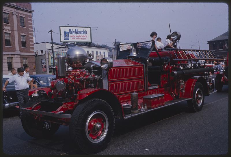 Antique fire engine in parade, Union Square, Somerville, Massachusetts