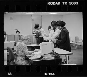 People wait at a government office, probably for civil wedding ceremonies