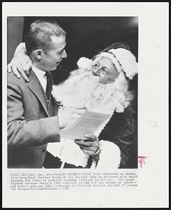 Chicago – Charley Grimm’s Fairy Tale – Bedecked as Santa, vice president Charley Grimm of the Chicago Cubs is pictured with third baseman Ron Santo at contract signing ceremony in Chicago. The scene figured because Santo’s 1963 contract called for the amount he asked – and didn't get it – in 1962, although his batting average skidded 57 points.
