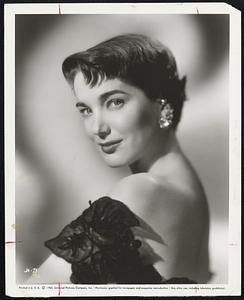 Julie Adams, arresting beauty of Universal-International films, proves her dramatic talent as well as her adaptability in three new films to be released soon. In "The Looters," a melodramatic suspense film about an airplane crash in the Rockies, she is starred with Rory Calhoun and Ray Danton (now her husband). In "The Private War of Mayor Benson" Julie will star with Charlton Heston in a modern comedy. And in "One Desire" to be released in mid-summer, Julie will star with Rock Hudson and Anne Baxter in a period drama.