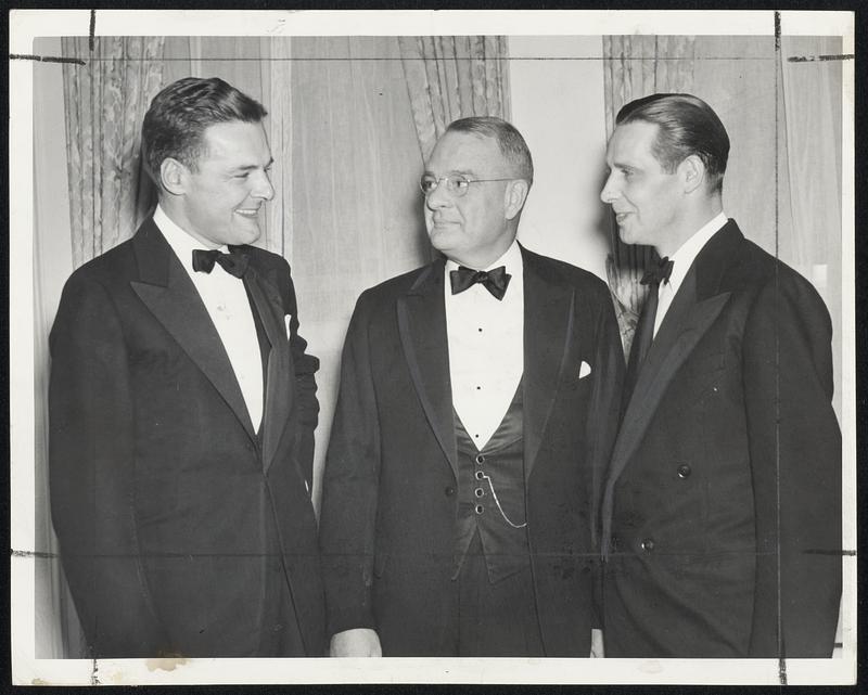 Speakers at the annual winter banquet of the Apartment Owner's Association of Boston in the Hotel Kenmore last night. Left to right: U. S. Senator Henry Cabot Lodge, Jr.; George K. Higgins, president of the association, and Mayor Tobin.