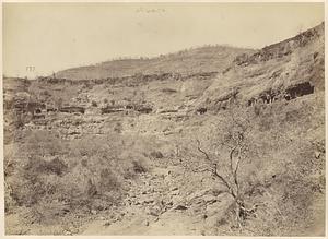 General view of Ajanta Caves XVI-XXVII from the ravine below
