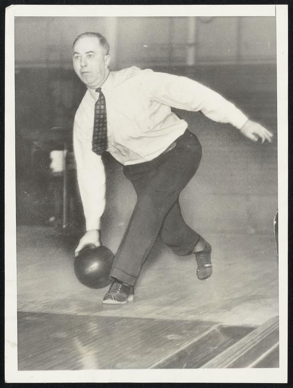 He's Bowling Now. Fort Wayne, Ind. This is Everett 'Deacon' Scott, speedy shortstop who once set a major league record of 1,307 consecutive games while helping the Boston Red Sox at New York Yankees win pennants between 1914 and 1925. He has not seen a major league game in ten years. His big interest is bowling and this photo shows him quickening his eye on his own alleys here for the American Bowling Congress opening at Indianapolis March 10.