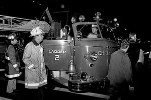 Left to right, firefighter Gil McGinnis, Deputy Fred Resca, firefighter Steven Denning driving and Dept. mechanic Charlie Garbarino