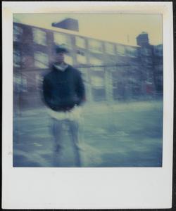 Young man standing in Newtowne Court