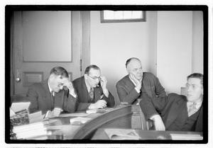 Group of men at table
