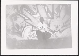 Boy sitting in the Teen Program Room