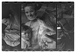 Maude Sanromá holding a child