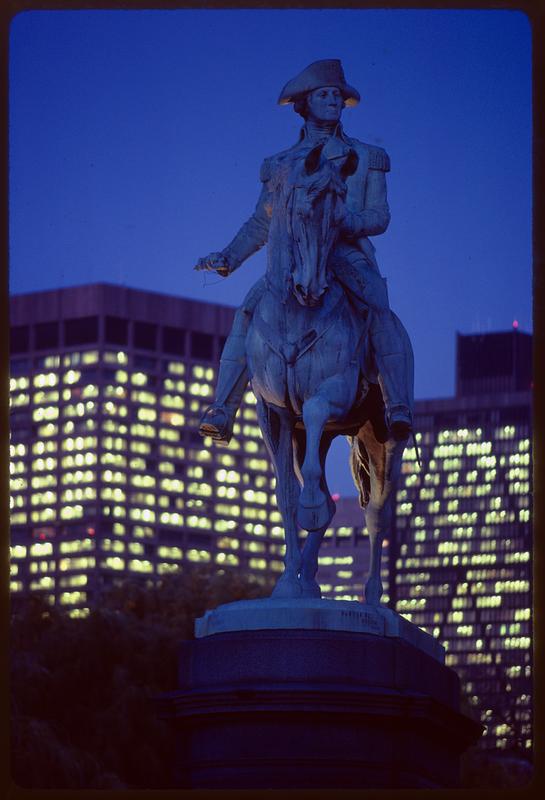 George Washington statue with McCormick Building in background at dusk, Boston Public Garden
