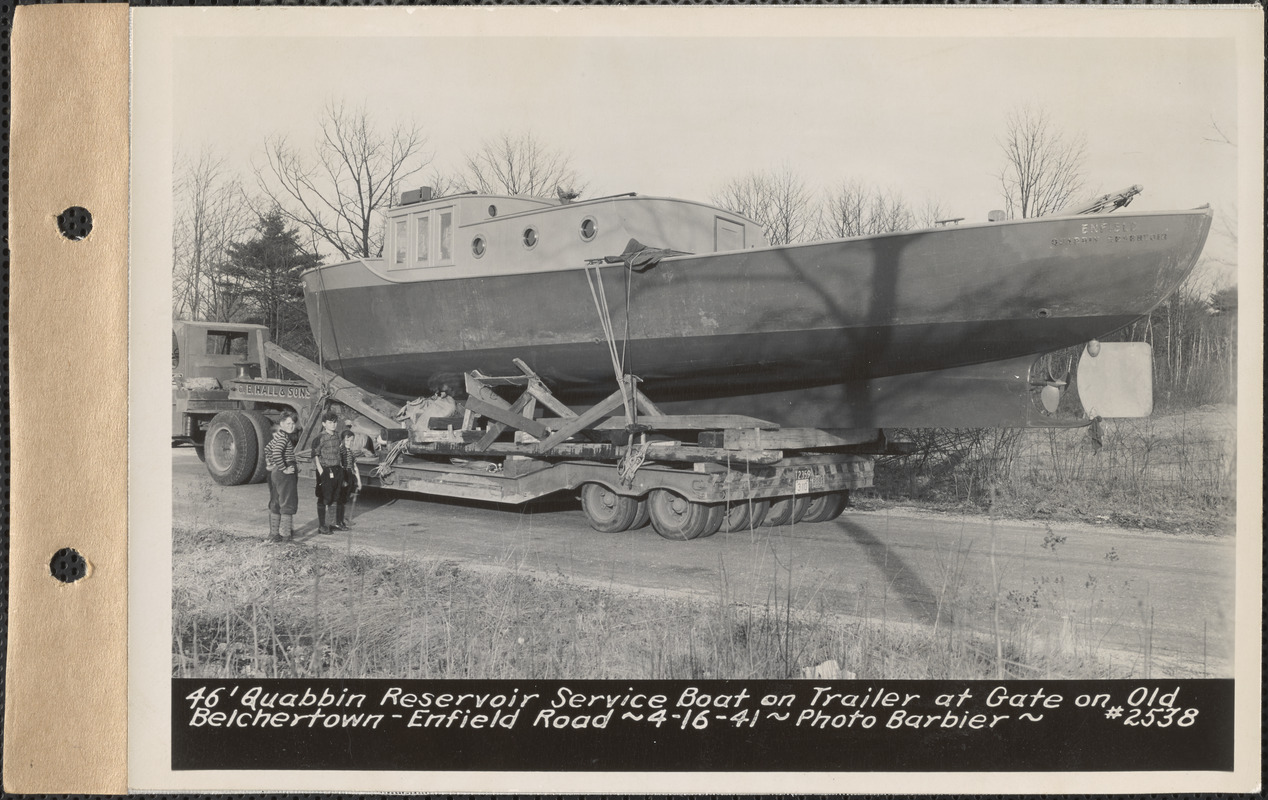 46-foot Quabbin Reservoir service boat on trailer at gate on old Belchertown-Enfield Road, Quabbin Reservoir, Mass., Apr. 16, 1941