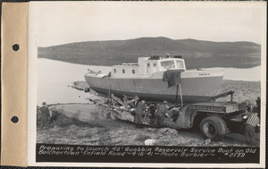 Preparing to launch 46-foot Quabbin Reservoir service boat on old Belchertown-Enfield Road, Quabbin Reservoir, Mass., Apr. 16, 1941