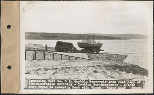 Launching boat #3 in Quabbin Reservoir from boat ramp at Administration Building, looking northwesterly, army truck is lowering boat with winch, Quabbin Reservoir, Mass., May 4, 1943