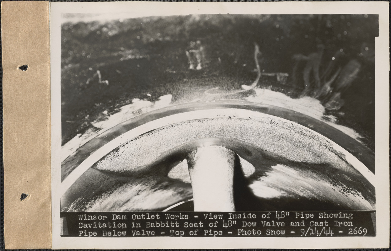 Winsor Dam Outlet Works, view inside of 48" pipe showing cavitation in Babbitt seat of 48" Dow valve and cast iron pipe below valve, top of pipe, Quabbin Reservoir, Mass., Sep. 14, 1944