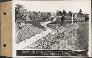 General view showing grading and cobble gutter on north side of East Access Road entrance, looking easterly, Ware, Mass., Nov. 26, 1945