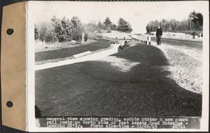 General view showing grading, cobble gutter, and new guard rail posts on north side of East Access Road entrance, looking northeasterly, Ware, Mass., Nov. 26, 1945
