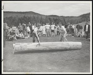 Log Rollers -- Two Dartmouth students use peaveys to maneuver a ton log 40 feet in a race in which speed and accuracy are of prime importance.