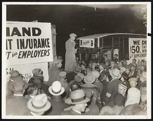 Exhorts Marches Comrades. Herbert Benjamin, a leader of the demonstrators who trekked into Washington, D.C., on the eve of the opening of the short term of the 72nd congress, giving his followers a little advice after they had been herded into an isolated street in an outlying section of the city December 4.