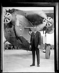 Charles Lindbergh standing in front of his plane, "Spirit of St. Louis"