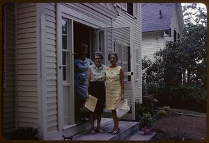 Women by the front door of a house on the bicentennial house tour