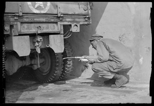 U. S. Army soldier inspecting truck, Waiblingen, Germany