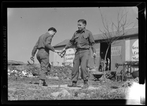 Jerome Mottola, of the U. S. Army's 649th Engineer Battalion, left, and an unidentified soldier pitching horseshoes, Rambervillers, France