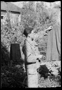 U. S. Army soldier hanging laundry, Waiblingen, Germany