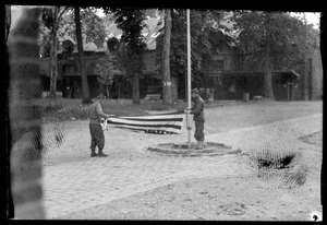 U. S. Army soldiers folding American flag, Fontainebleau, France