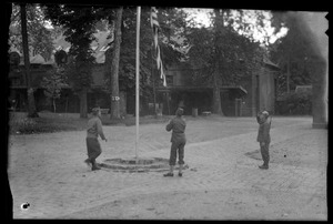 U. S. Army soldier raising or lowering American flag, Fontainebleau, France