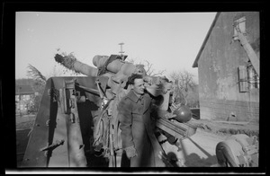 Warren Favor, of the U. S. Army's 649th Engineering Battalion, with artillery gun, Dabo, France